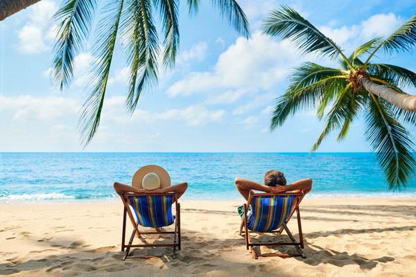 Ilustrasi liburan di pantai saat libur Nataru (FOTO: GETTY IMAGES) 