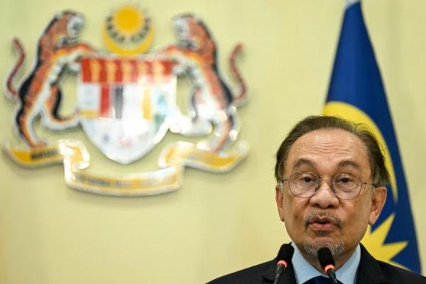 Perdana Menteri Malaysia Anwar Ibrahim saat konferensi pers di Putrajaya dekat Kuala Lumpur pada 21 November 2024. Pool via REUTERS 